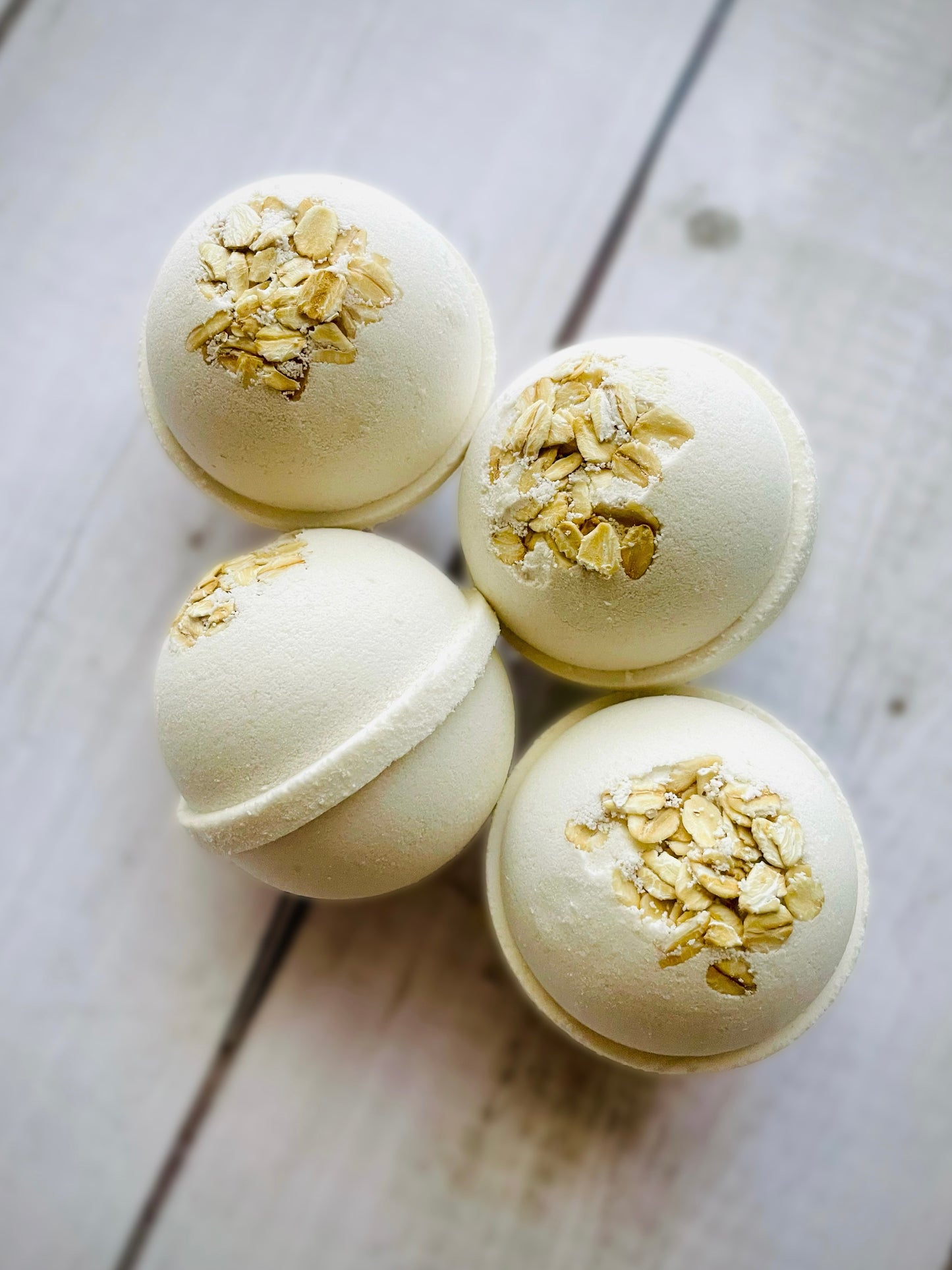 Four bath bombs with a Saturn ring.