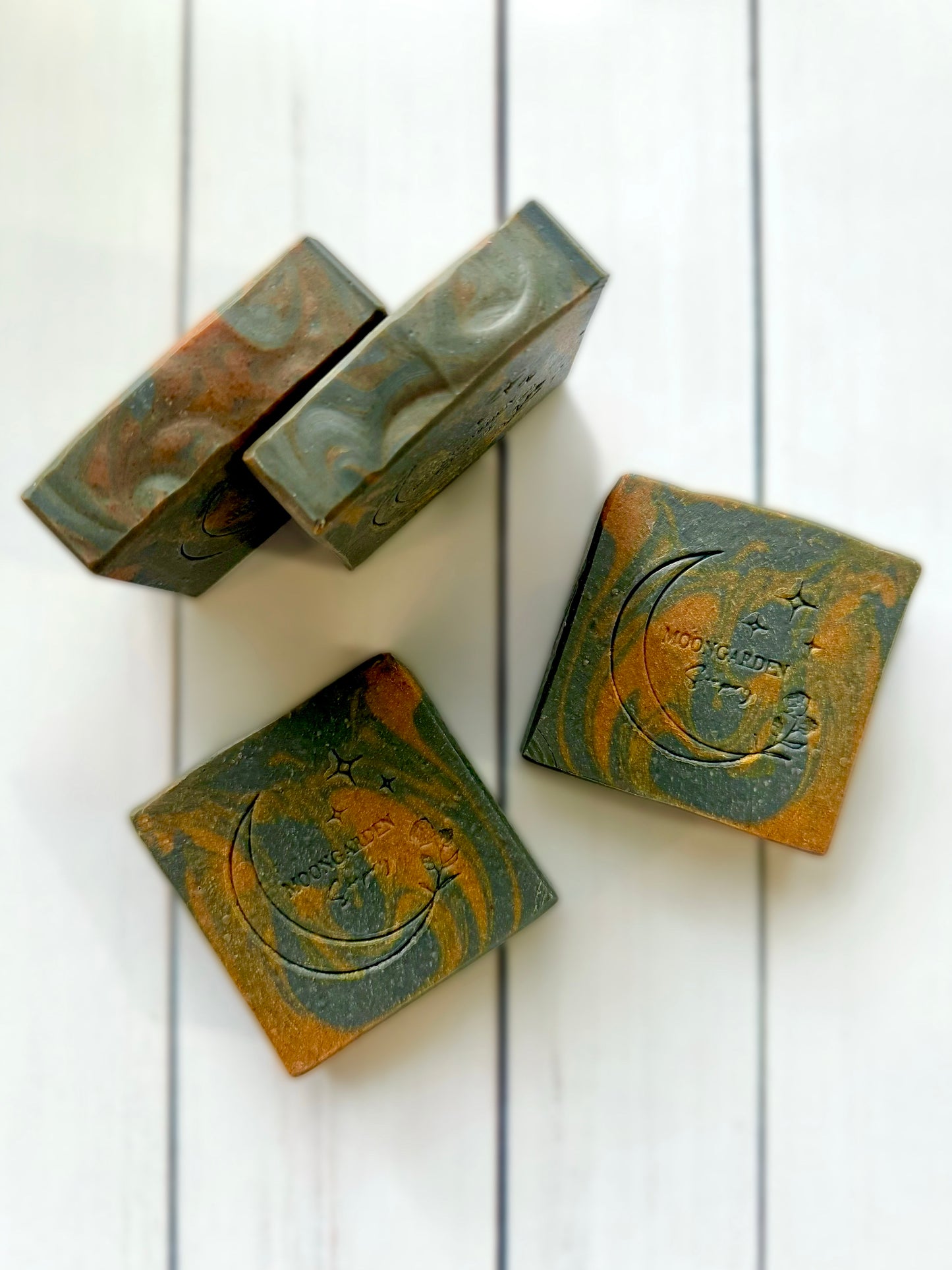 Four bars of handmade soap.
