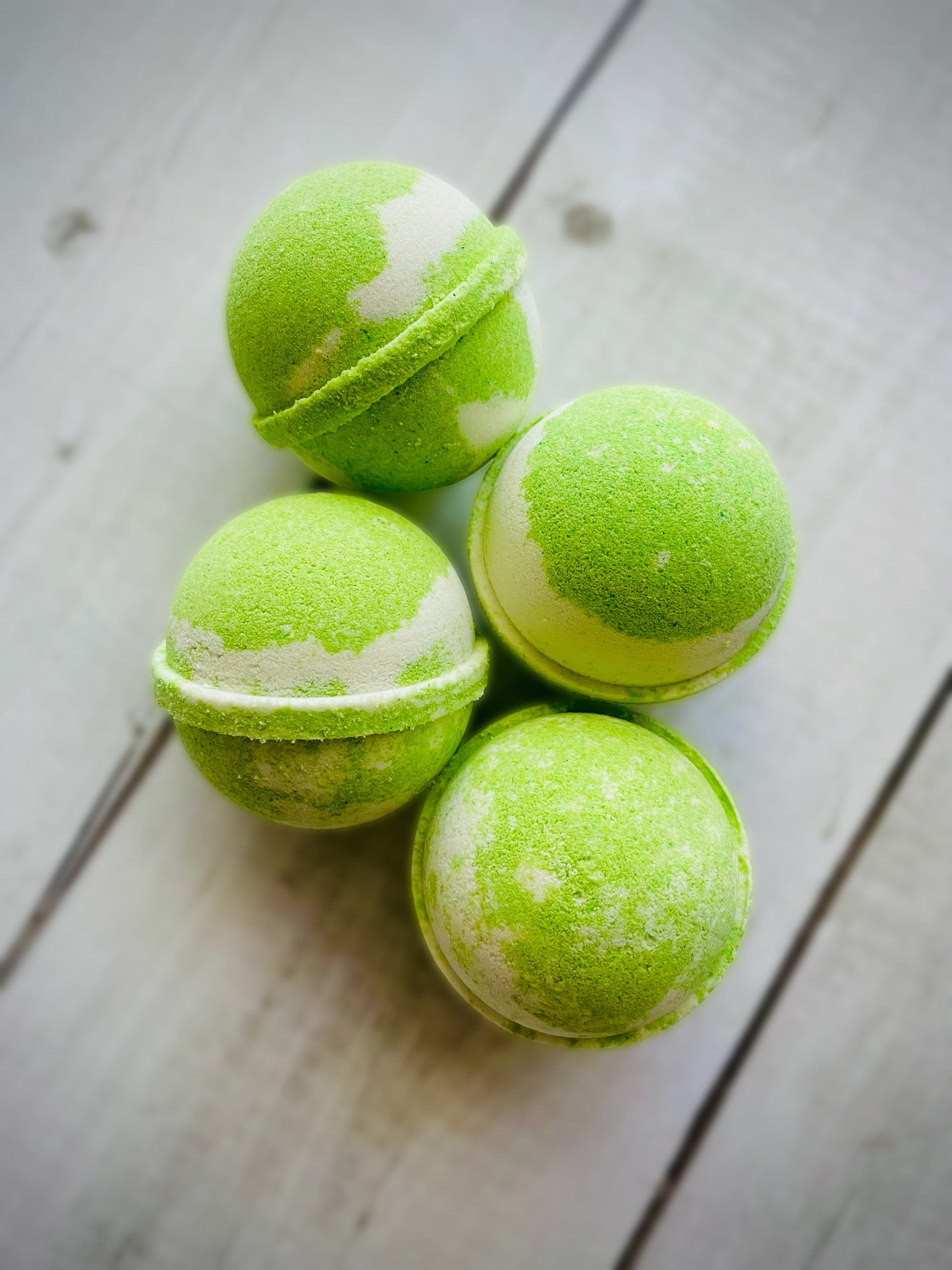 Four bath bombs with a Saturn ring.