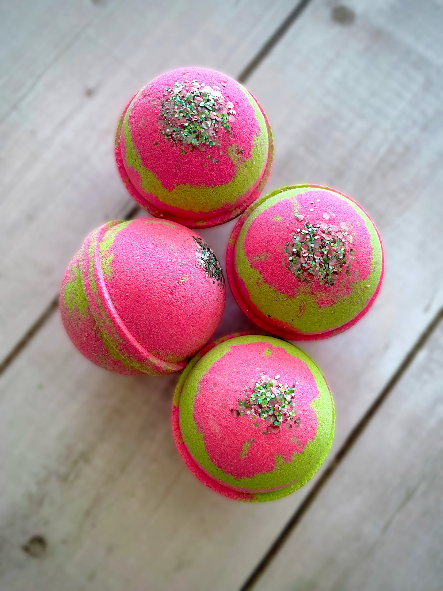 Four bath bombs with a Saturn ring.
