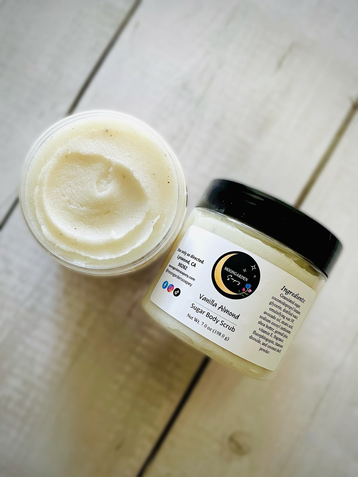 Two jars of vanilla almond sugar scrubs.