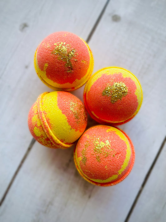 Four bath bombs with a Saturn ring. 