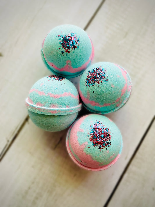 Four bath bombs with a Saturn ring. 