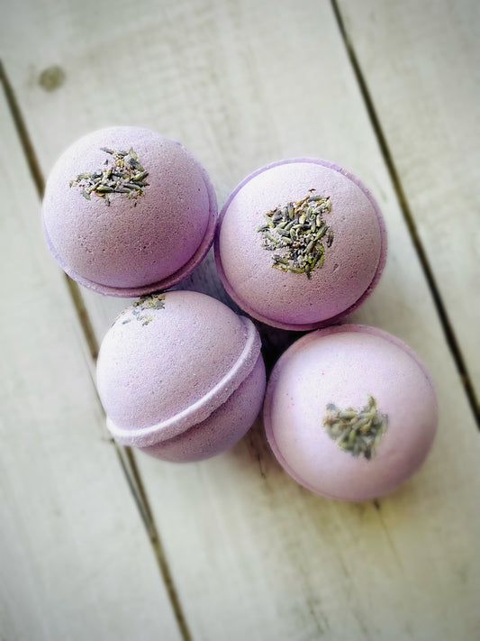 Four bath bombs with a Saturn ring. 