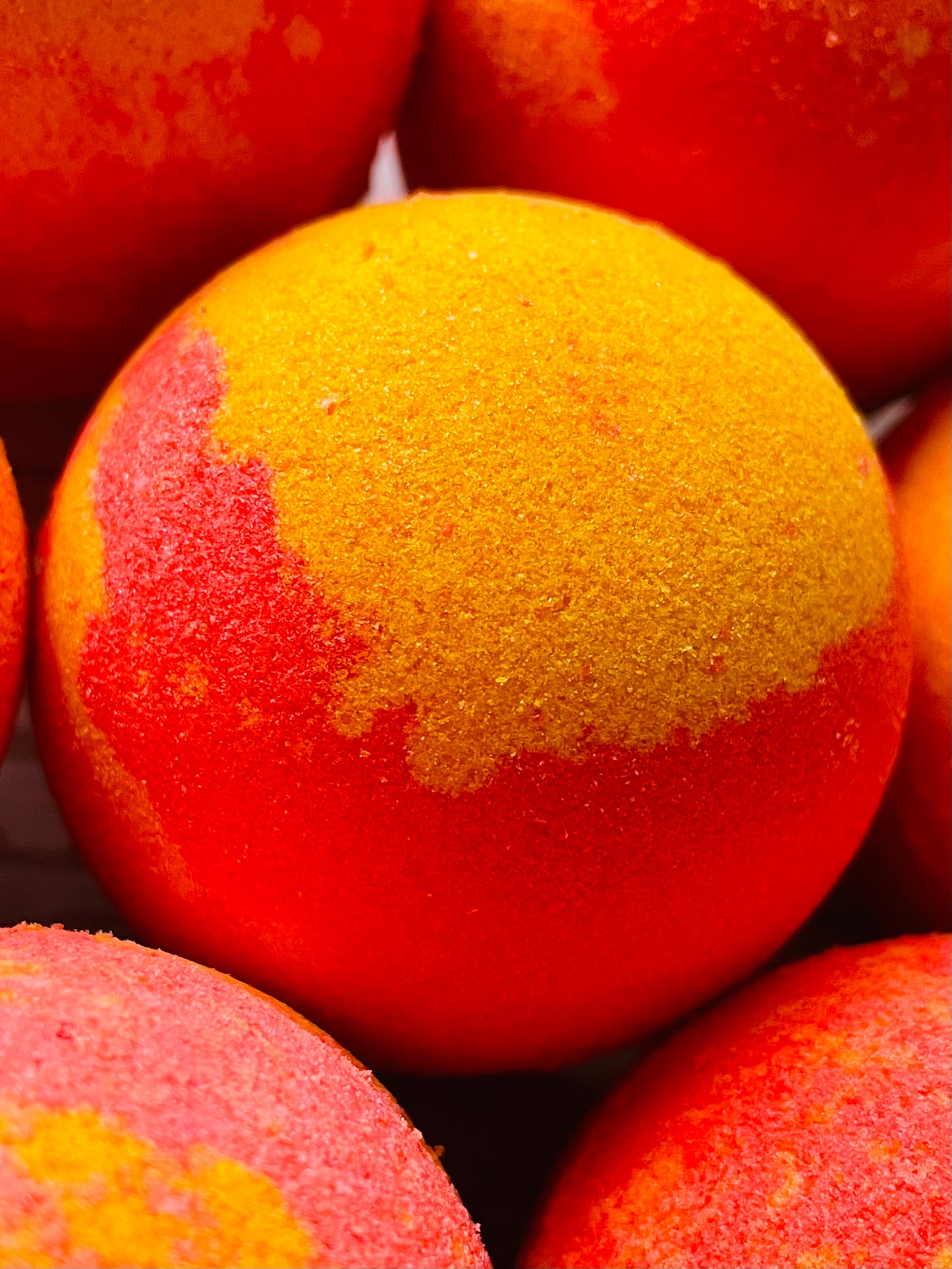 A closeup of peach bath bombs.