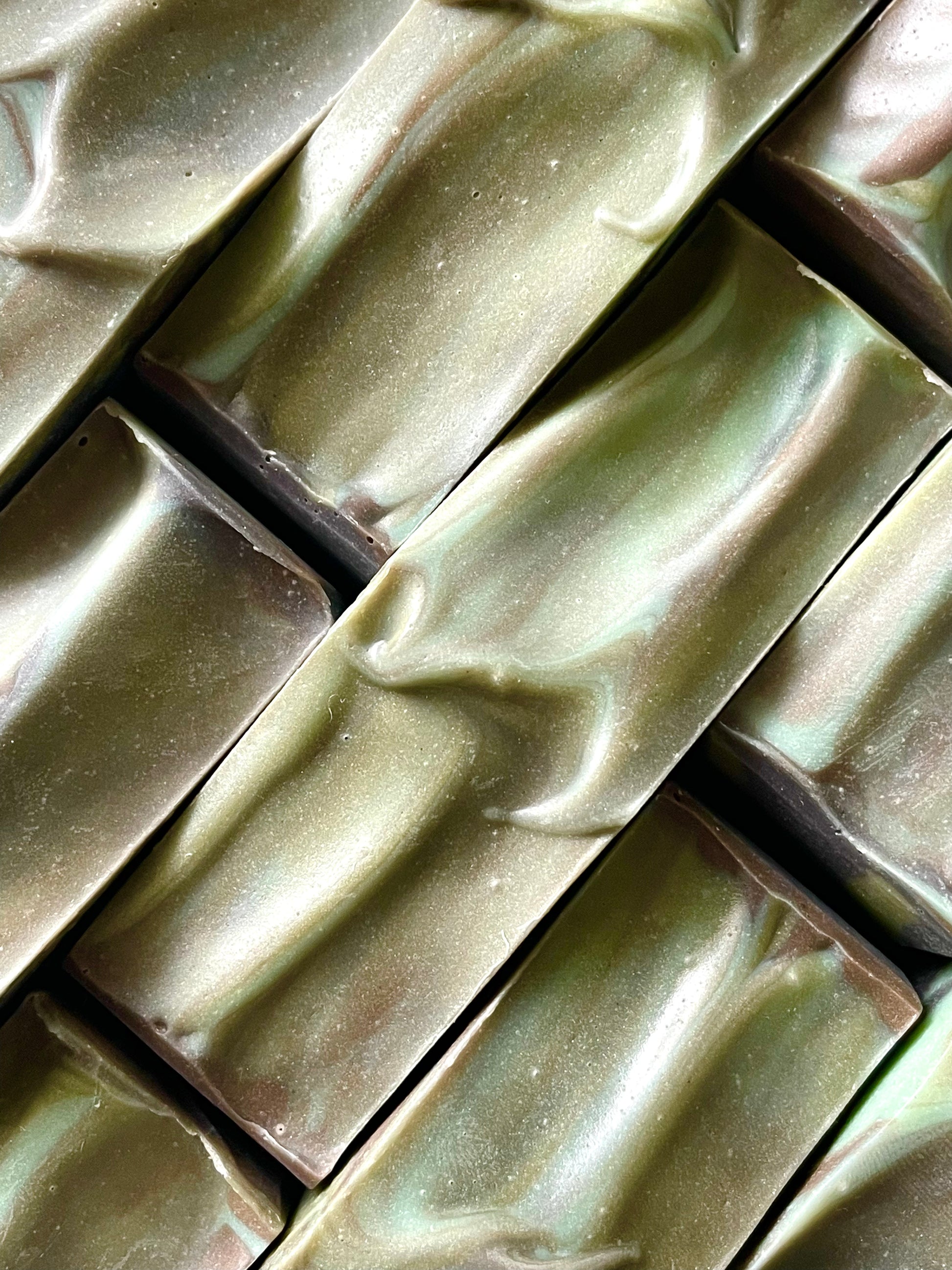 A closeup of the tops of Still Smoking in Havana bar soaps. 