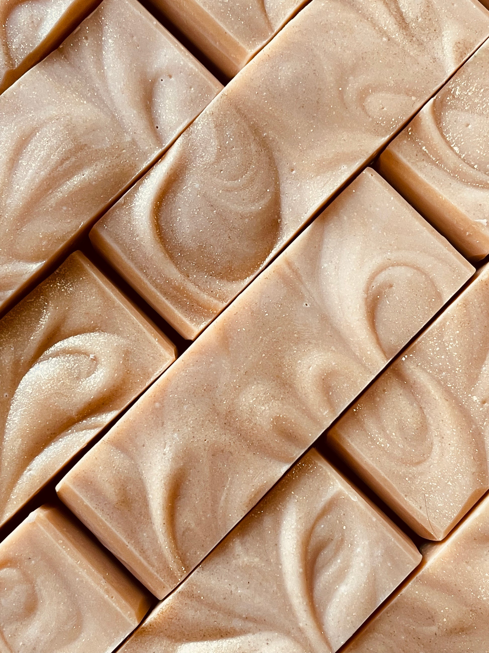 A closeup of the tops of The Last Golden Ticket bar soaps. 