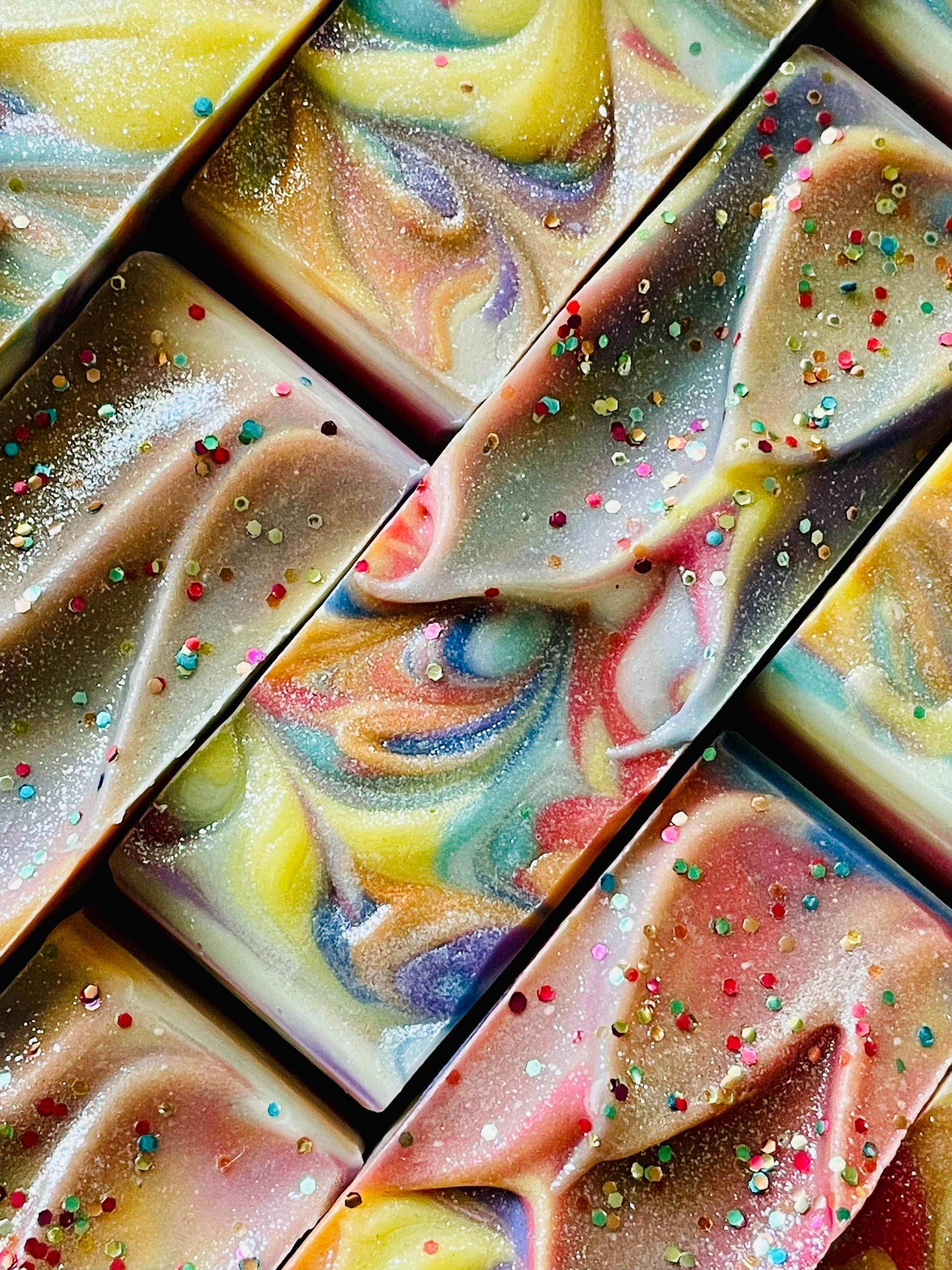 A closeup of the tops of Love Always Wins bar soaps. 