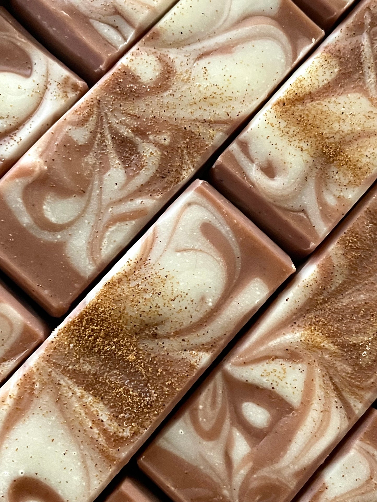 A closeup of the tops of Nutty by Nature sweet almond bar soaps. 